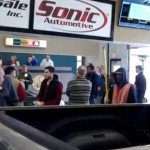 People attending a car auction